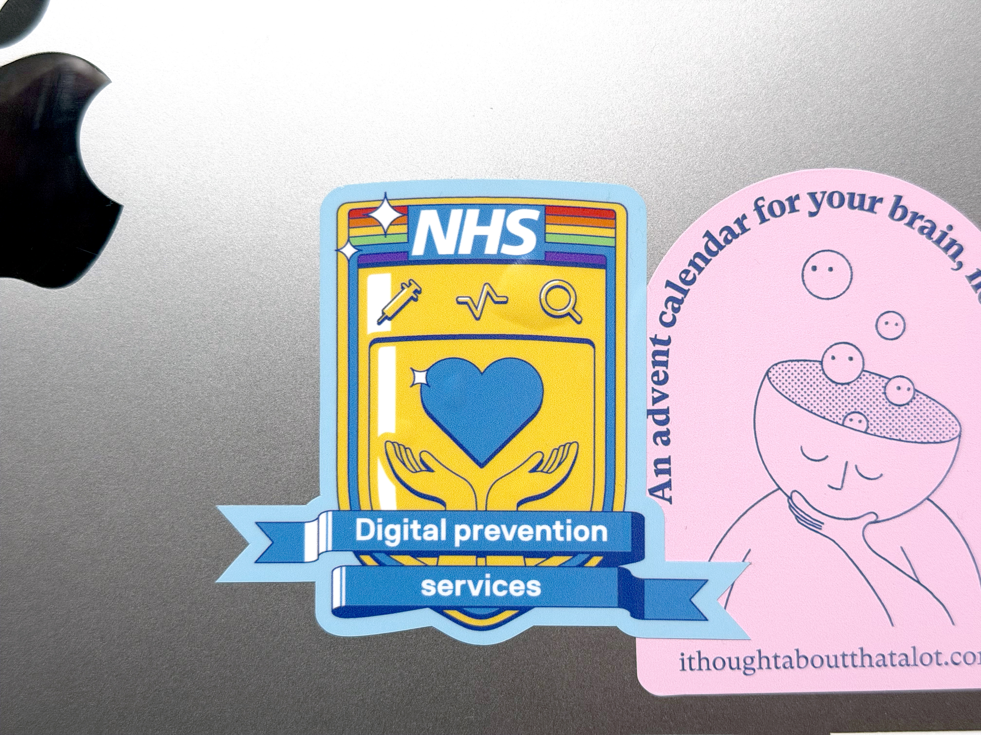 Photo of the printed sticker on a MacBook laptop